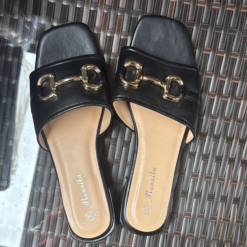 amika Black and Gold Flats with Elegant Hardware